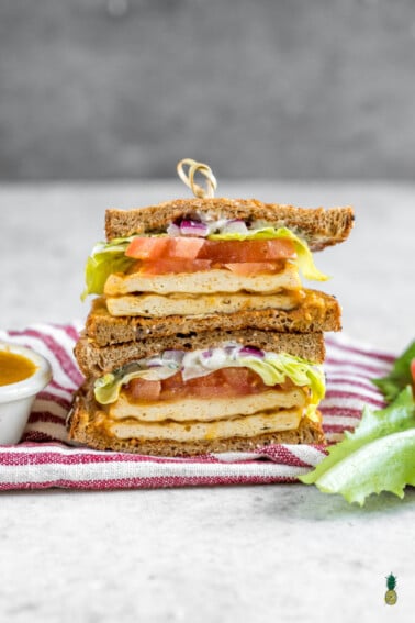 A delicious and easy to make buffalo tofu sandwich with homemade vegan ranch dressing - sweetsimplevegan.com #vegan #sandwich #buffalo #tofu #entree #veganized #veganlunch #ranchdressing