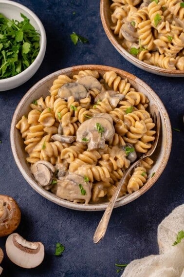 vertical photo of mushroom stroganoff in bowl