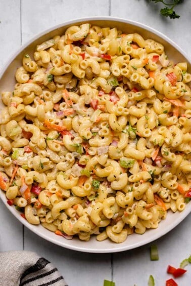 close up of vegan macaroni salad in ceramic bowl