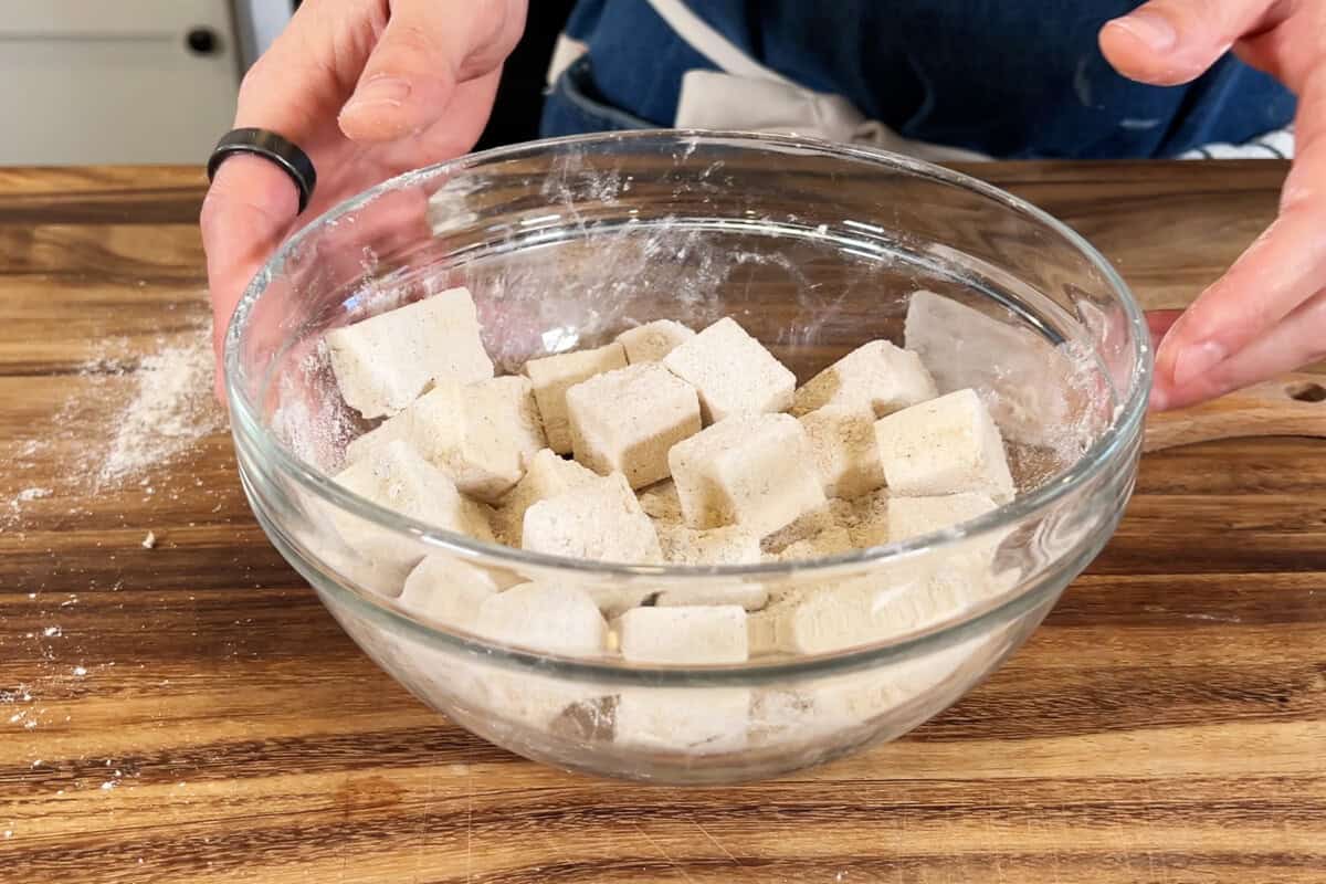 coating tofu in seasoning mixture