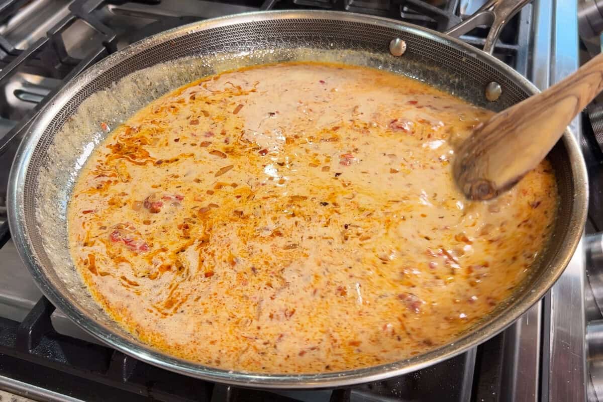 mixing sauce in skillet