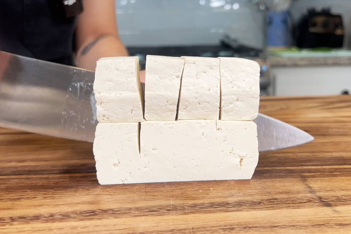 slicing tofu into cubes