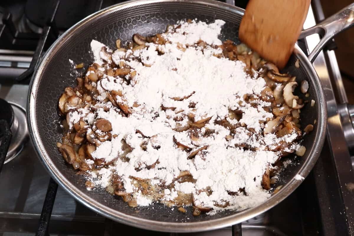 adding flour to gravy mixture