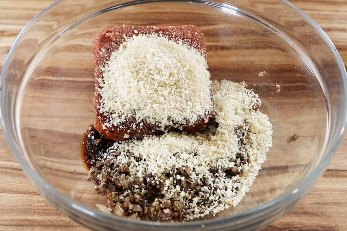 adding the remainder of burger steak ingredients to the bowl