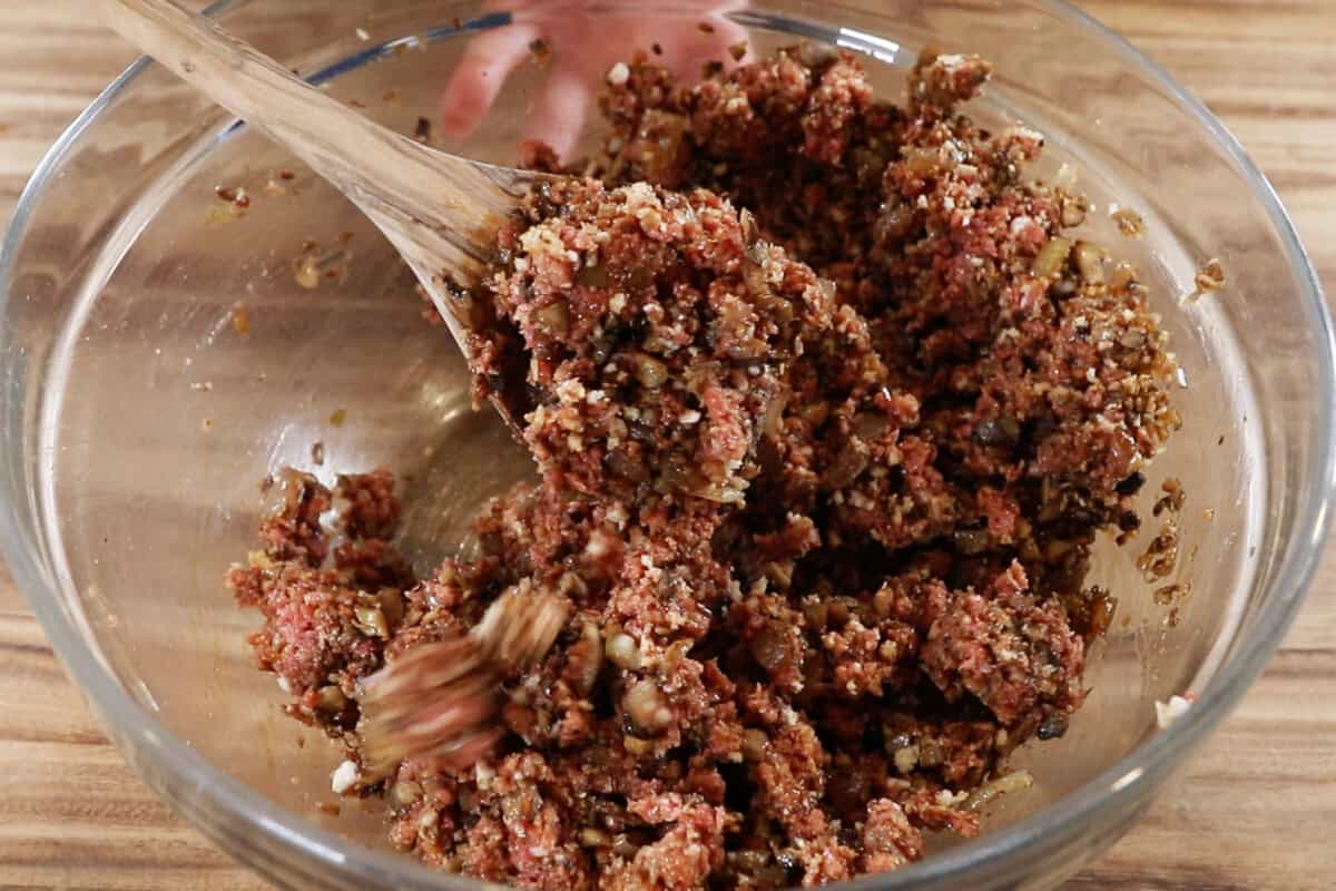 mixing the burger steak filling in a bowl