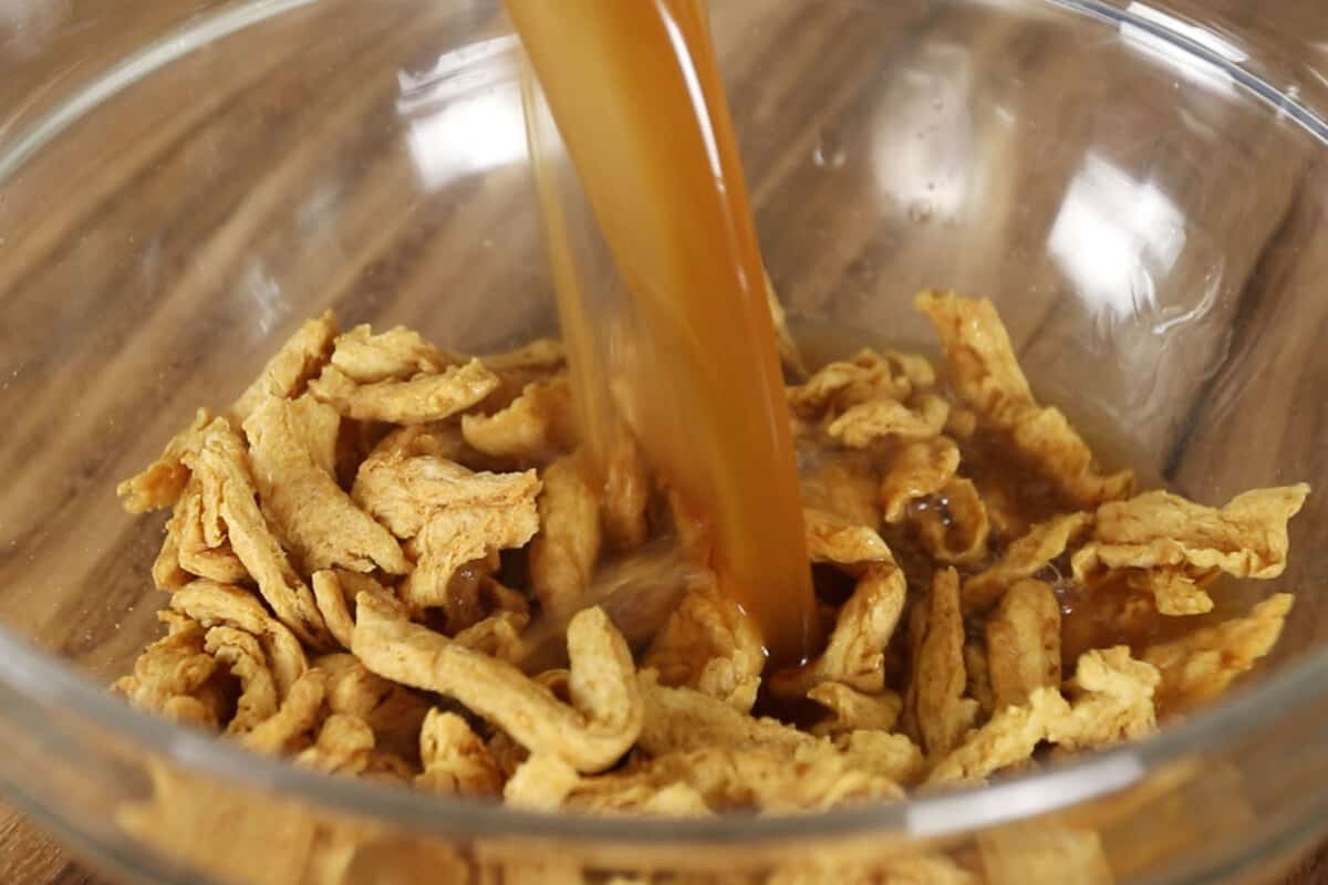 step by step - broth being poured into soy curls