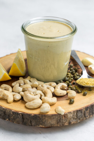 This vegan Caesar salad dressing will fool ya for the real thing! It super easy to make with less than 10-ingredients plus all of the ingredients are simple and include stuff your probably already have in your pantry. This dressing will take your salads to the next level and we promise you are going to love it.  #caesar #salad #homemade #glutenfree #schoollunch #onthego #vegan #sweetsimplevegan #lunch #entree #togo #lunchbox #easy #filling #cashewcream #veganized #party #sauce