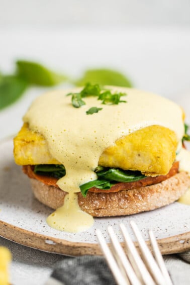 A close up shot of Vegan Eggs Benedict with Hollandaise