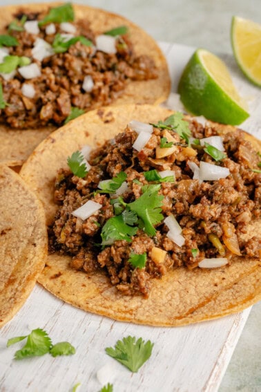 taco filled with vegan ground beef and topped with onion and cilantro