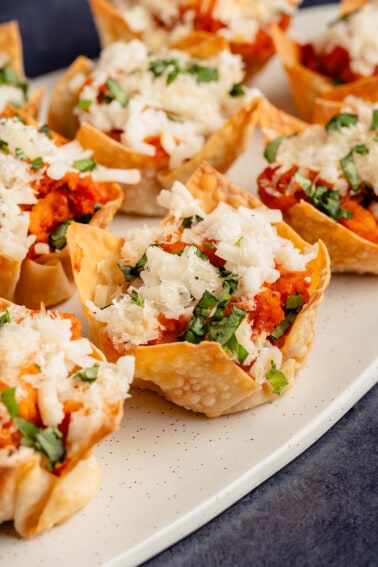 chicken parm bites lined up on a plate