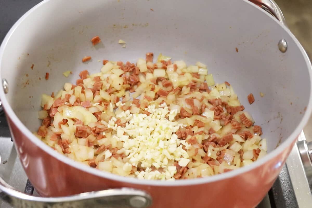 garlic being added to pot