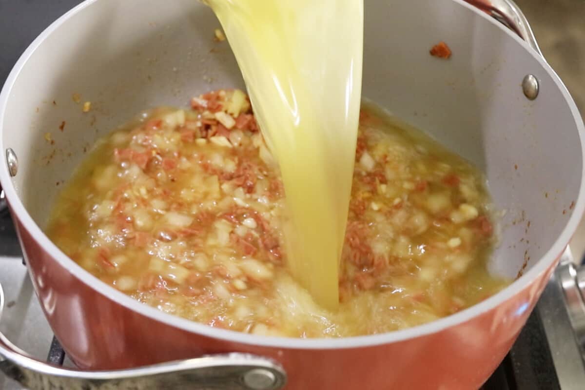 broth being added to pot